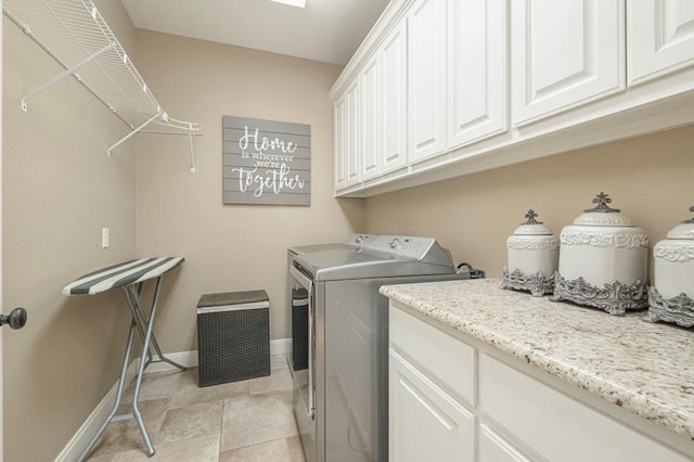 laundry area with cabinets and independent washer and dryer