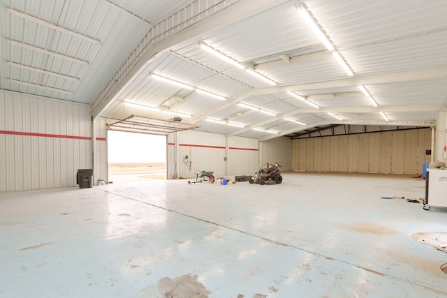 garage featuring wood walls