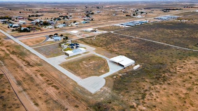 birds eye view of property featuring a rural view