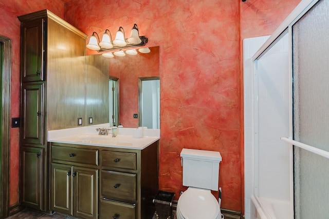 full bathroom featuring vanity, toilet, and shower / bath combination with glass door