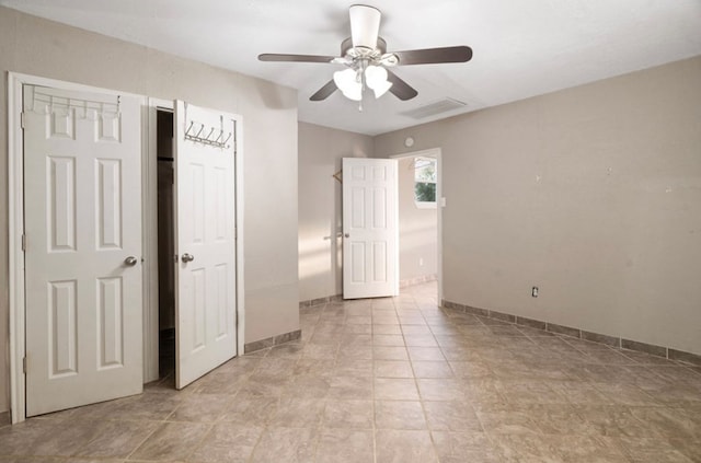 unfurnished bedroom featuring light tile patterned floors and ceiling fan