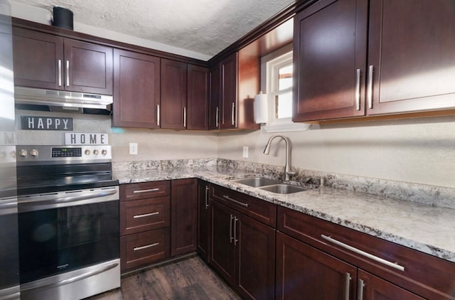 kitchen with stainless steel range with electric stovetop, sink, a textured ceiling, dark hardwood / wood-style flooring, and light stone counters