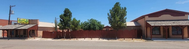 view of side of property with fence