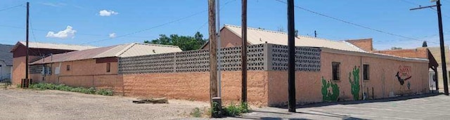 view of side of property with fence