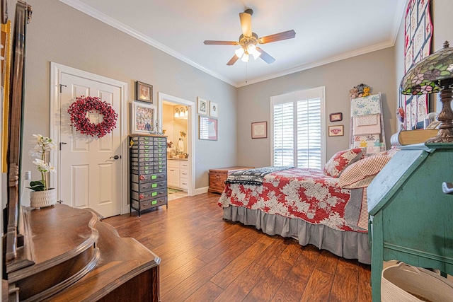 bedroom featuring hardwood / wood-style flooring, ensuite bath, ceiling fan, and crown molding