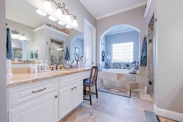 bathroom with vanity, ornamental molding, and plus walk in shower