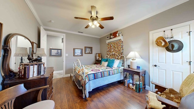 bedroom with dark hardwood / wood-style flooring, ceiling fan, and ornamental molding