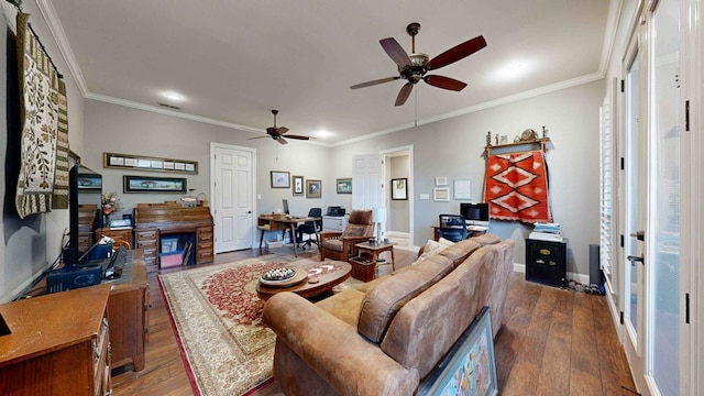 living room featuring dark hardwood / wood-style floors, ceiling fan, and crown molding