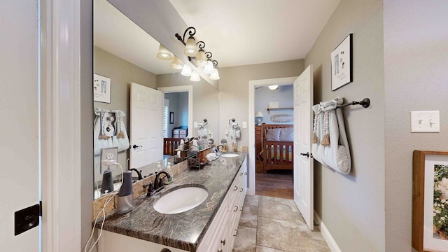 bathroom with tile patterned flooring and vanity