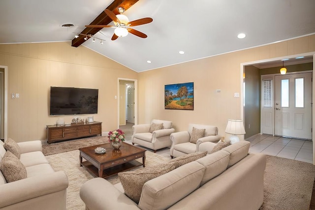 living room with vaulted ceiling with beams, ceiling fan, and light tile patterned flooring