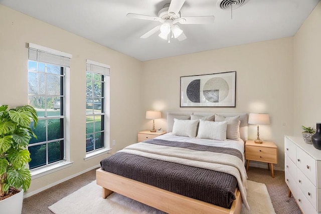 bedroom with ceiling fan and light colored carpet