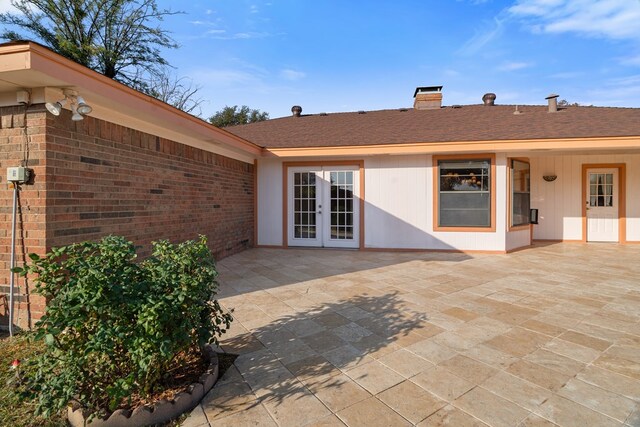 exterior space with french doors and a patio area