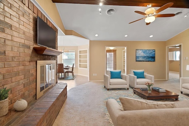 carpeted living room featuring ceiling fan, vaulted ceiling, and a brick fireplace