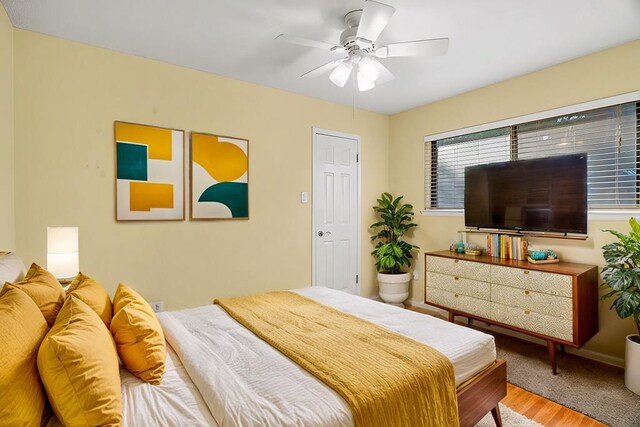 bedroom featuring hardwood / wood-style floors and ceiling fan