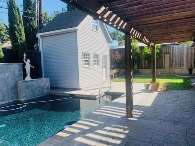 view of swimming pool featuring a patio area and a pergola