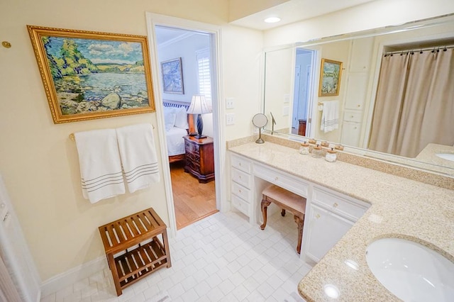 bathroom featuring tile patterned floors and vanity