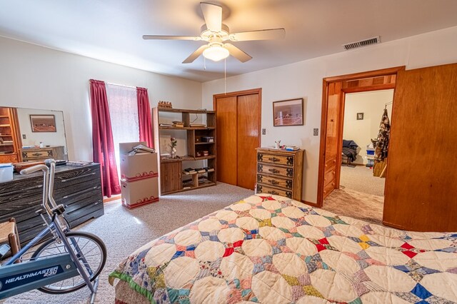 bedroom featuring ceiling fan and light colored carpet