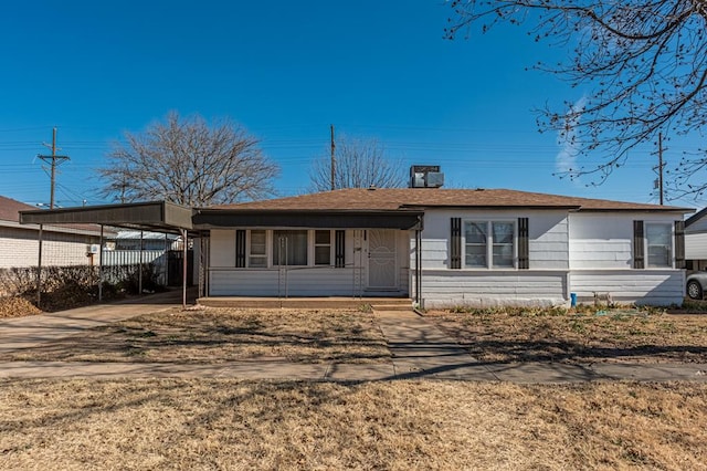 ranch-style house with a carport