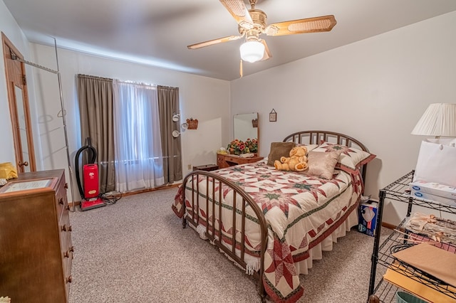 bedroom with light carpet and ceiling fan