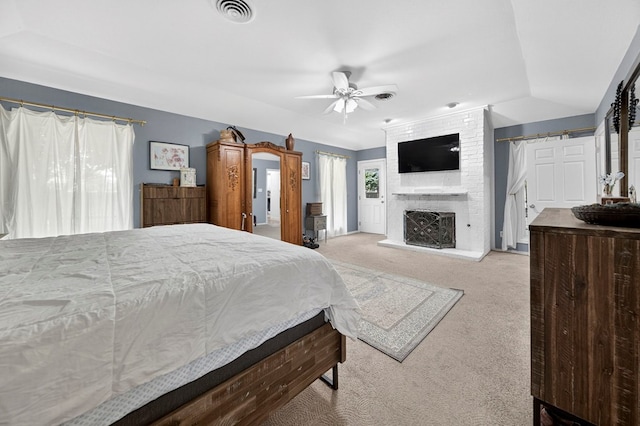 4502 Green Tree Blvd, Midland, TX 79707 - carpeted bedroom with a large fireplace and ceiling fan