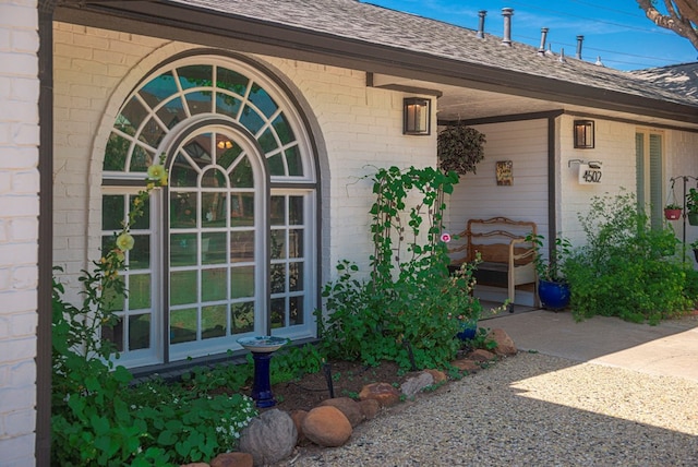 4502 Green Tree Blvd, Midland, TX 79707 - doorway to property with brick siding and roof with shingles