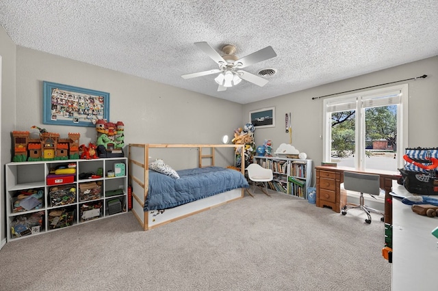 4502 Green Tree Blvd, Midland, TX 79707 - carpeted bedroom featuring an office area, a textured ceiling, and ceiling fan