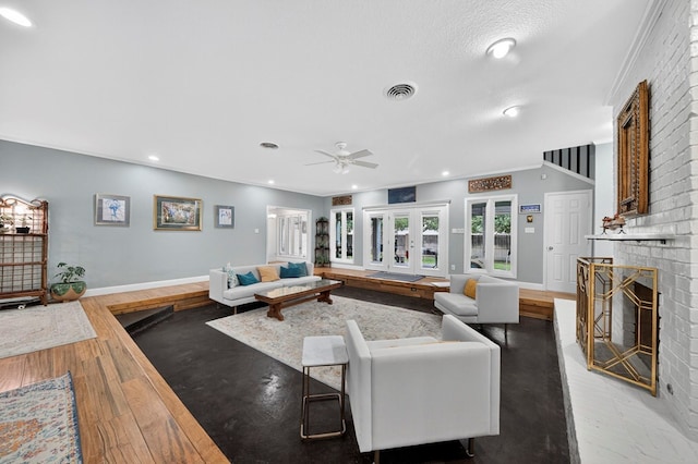 4502 Green Tree Blvd, Midland, TX 79707 - living area featuring a fireplace, ceiling fan, wood finished floors, and recessed lighting