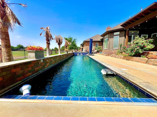 view of pool featuring fence and a fenced in pool