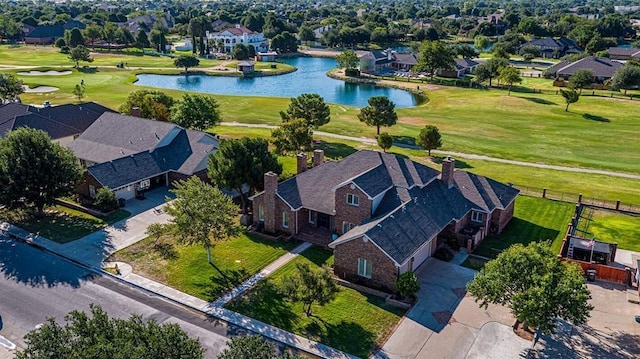 aerial view featuring a water view, a residential view, and golf course view