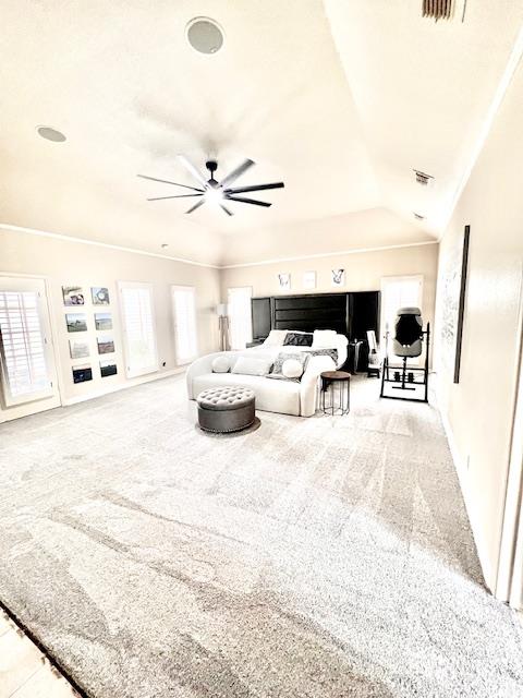 carpeted bedroom with crown molding, baseboards, and visible vents
