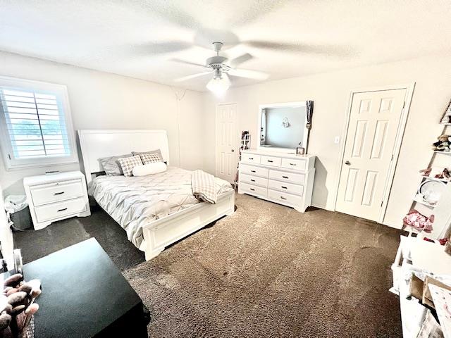 carpeted bedroom featuring a ceiling fan