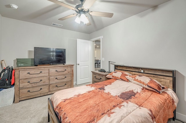 bedroom featuring visible vents, ceiling fan, and light carpet