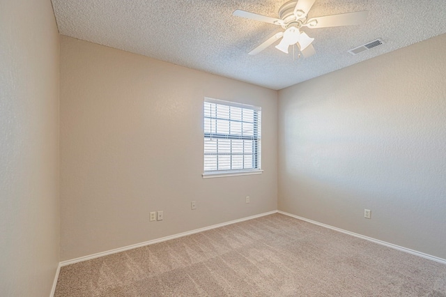 unfurnished room featuring light carpet, a textured ceiling, and ceiling fan