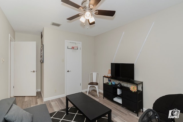 4313 Downing Ave, Midland, TX 79707 - living room featuring light wood-style flooring, a ceiling fan, and baseboards