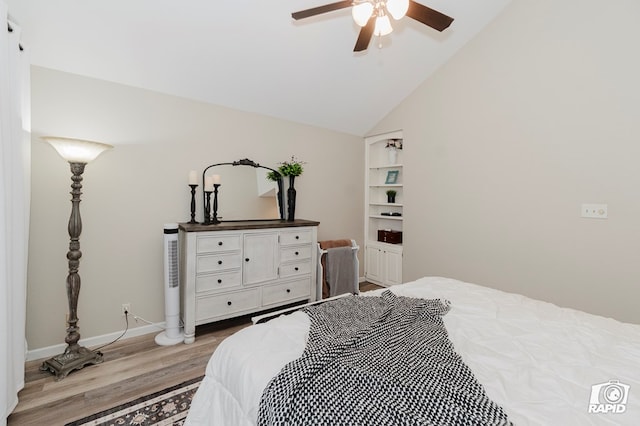 4313 Downing Ave, Midland, TX 79707 - bedroom with wood finished floors, vaulted ceiling, baseboards, and a ceiling fan
