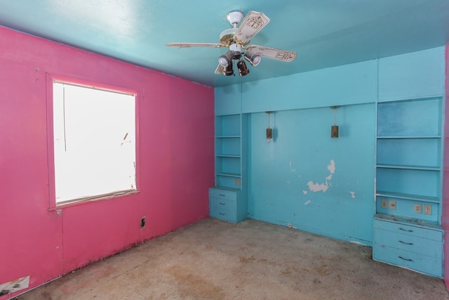 unfurnished bedroom featuring ceiling fan and light colored carpet