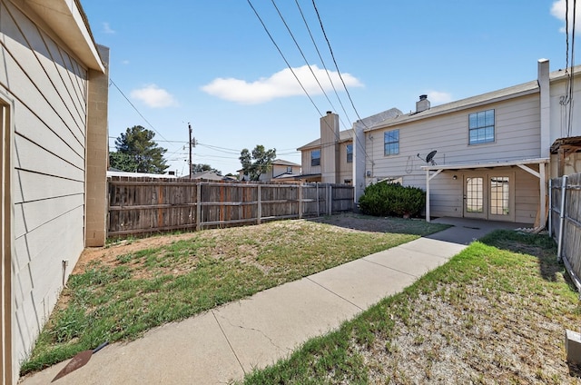 3208 Preston Dr, Midland, TX 79707 - fenced backyard featuring french doors