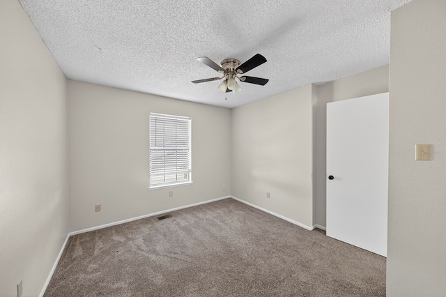 3208 Preston Dr, Midland, TX 79707 - unfurnished room featuring ceiling fan, carpet floors, and a textured ceiling