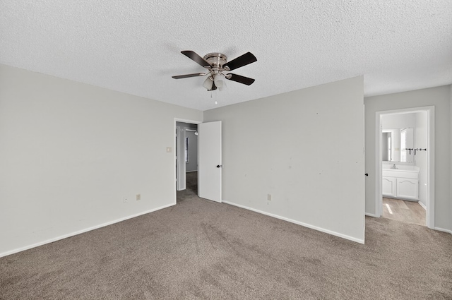 3208 Preston Dr, Midland, TX 79707 - unfurnished bedroom with carpet, a textured ceiling, ceiling fan, and ensuite bathroom