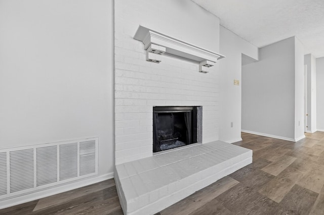 3208 Preston Dr, Midland, TX 79707 - detailed view of wood finished floors and a brick fireplace