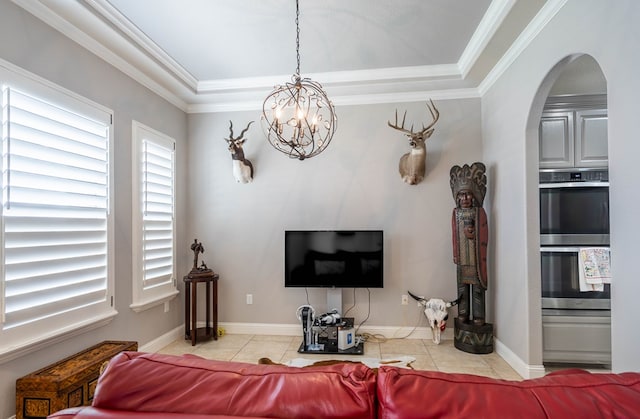 7209 E County Rd 96, Midland, TX 79706 - tiled living area with a chandelier, arched walkways, a tray ceiling, and ornamental molding