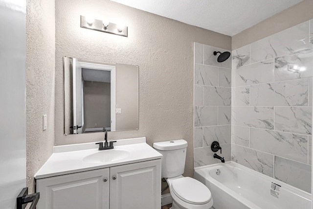 full bath featuring toilet, shower / bathtub combination, vanity, and a textured wall