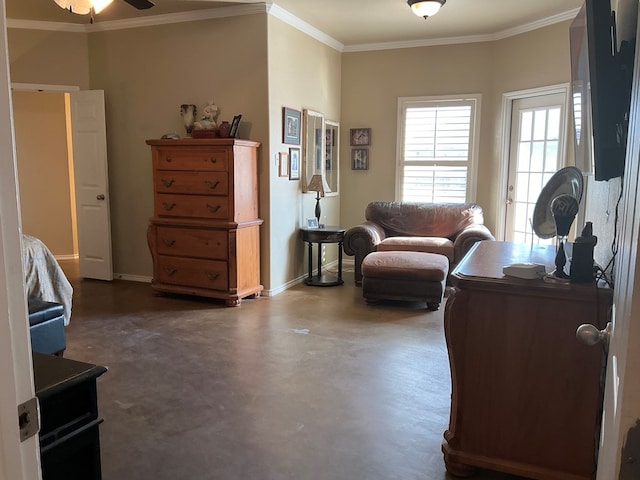 interior space featuring ceiling fan and crown molding