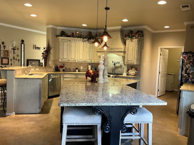 kitchen featuring a kitchen breakfast bar, sink, ornamental molding, decorative light fixtures, and light stone counters