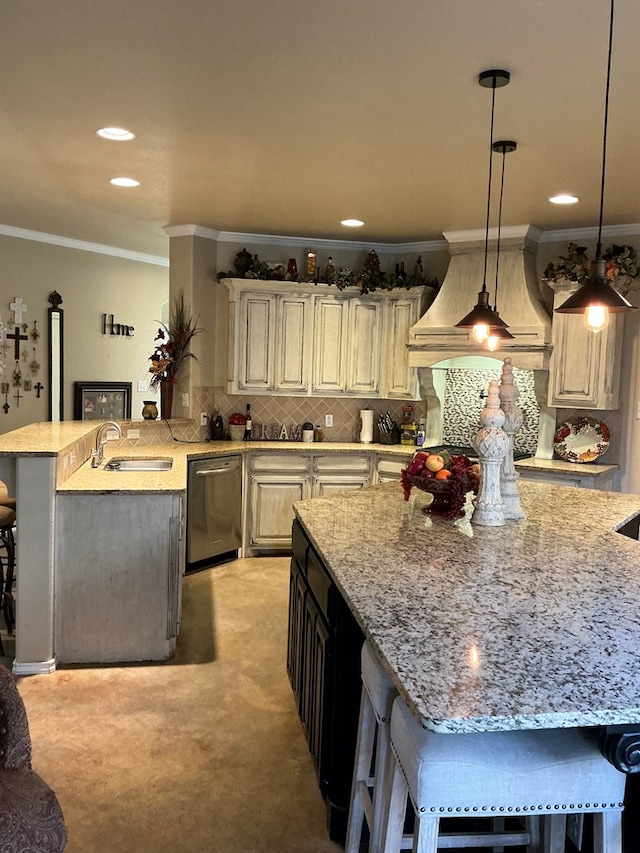 kitchen featuring stainless steel dishwasher, a kitchen bar, light colored carpet, and sink