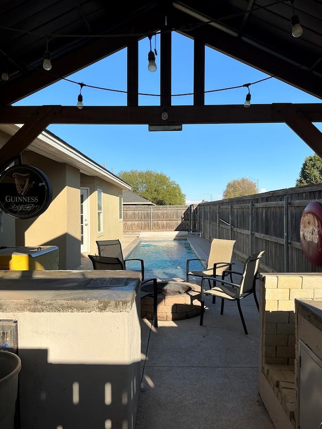 view of patio featuring a fenced in pool