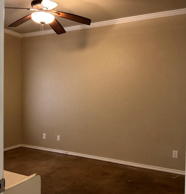 spare room with ceiling fan, dark carpet, and ornamental molding