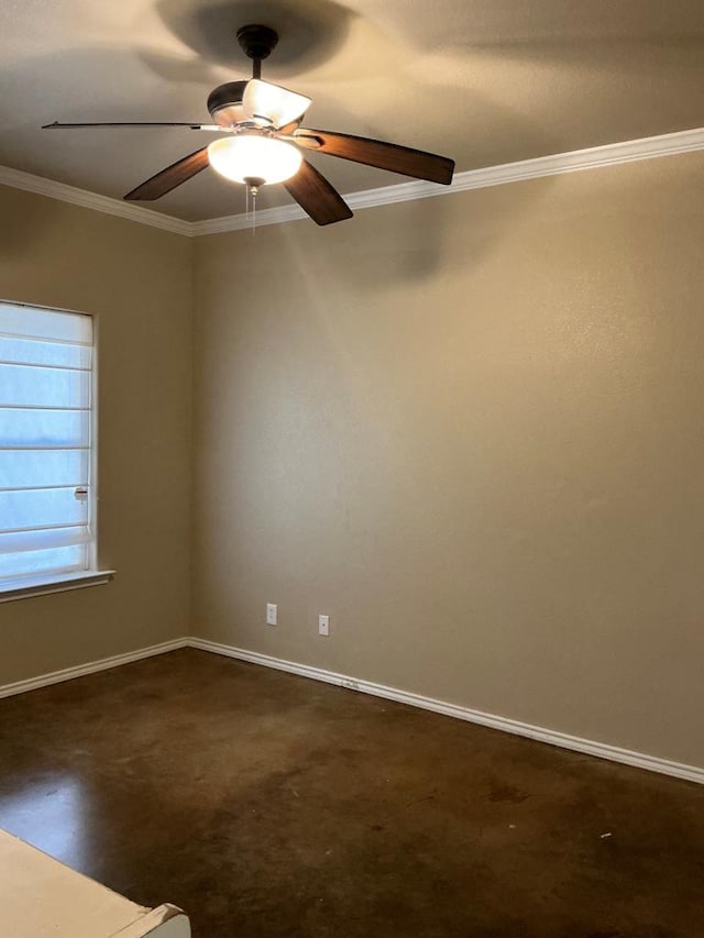 carpeted empty room with crown molding and ceiling fan