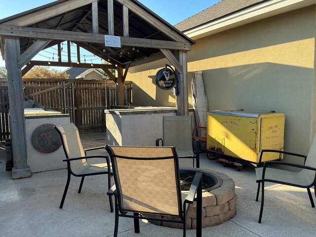 view of patio / terrace with a gazebo and an outdoor fire pit