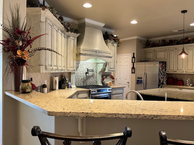 kitchen featuring ornamental molding, decorative light fixtures, a breakfast bar, custom exhaust hood, and appliances with stainless steel finishes